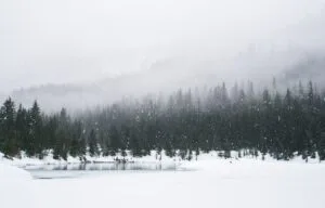 Winter home with snow covered roof